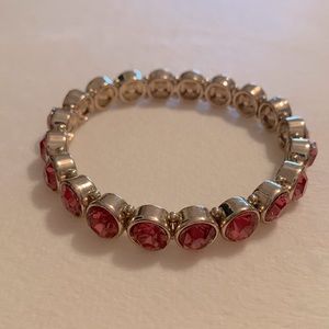 Dark pinkish/orange gold tone stretchy bracelet